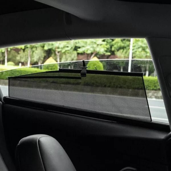 Mesh roller shade on a Tesla Model 3 door window