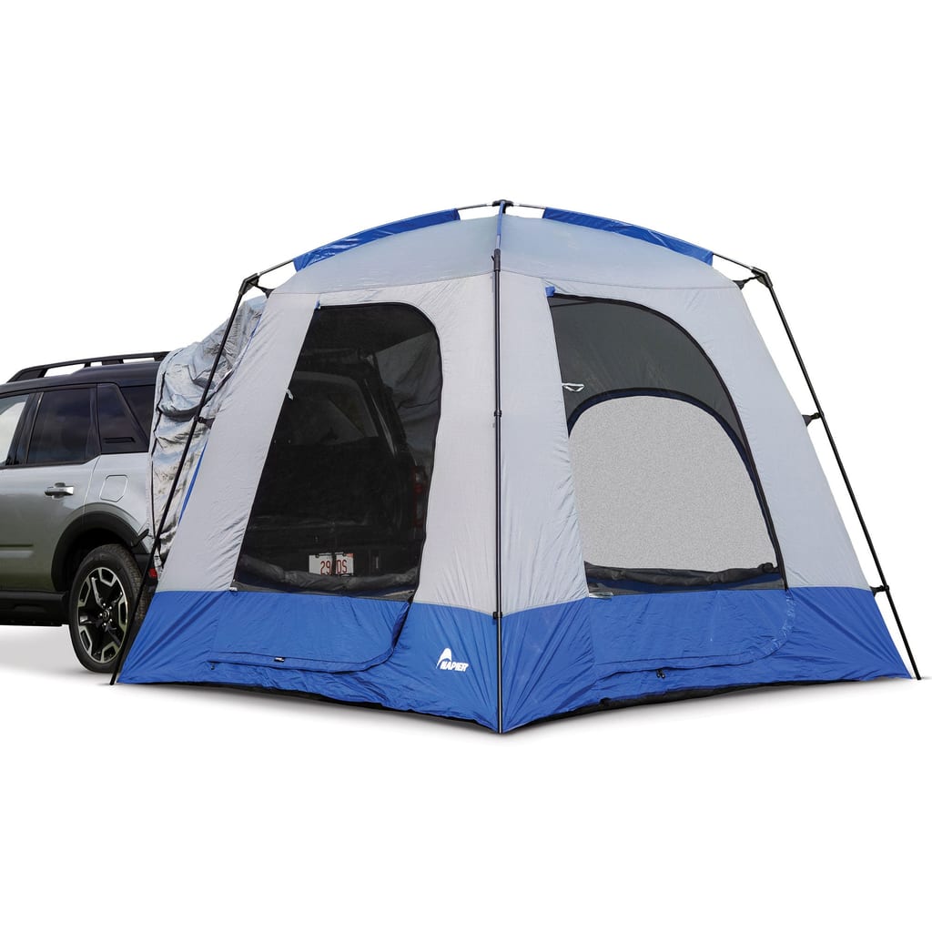 Napier Sportz SUV Tent pitched against the open hatch of an SUV
